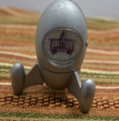 metal space rocket style cloxk says All star 2006 comes off the base untested